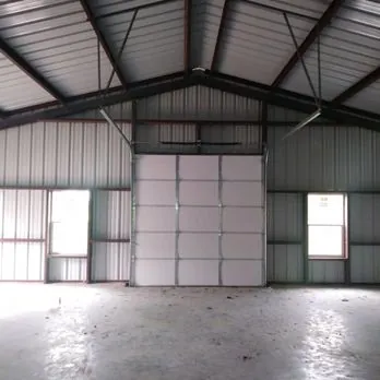 Steel building interior with a sectional door